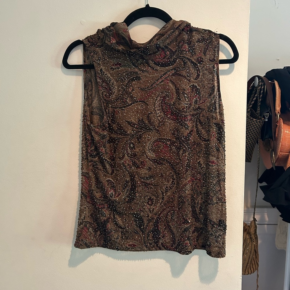 Beaded mock neck sleeveless top.